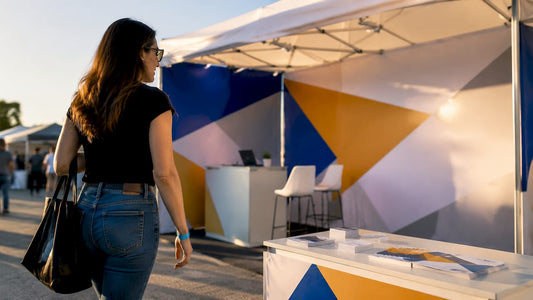 Attendee approaching brightly lit trade show booth